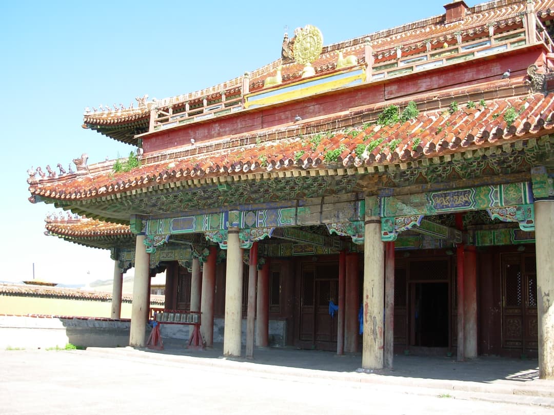 Low-angle view of a multi-tiered tiled hall at Amarbayasgalant Monastery.