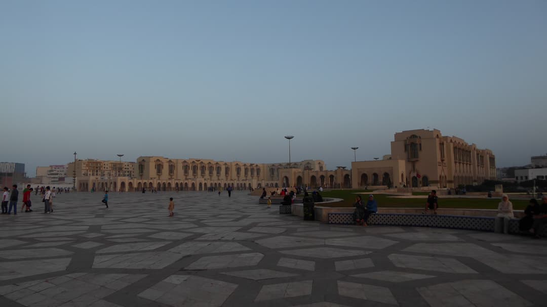 Esplanade and surrounding complex buildings at twilight.