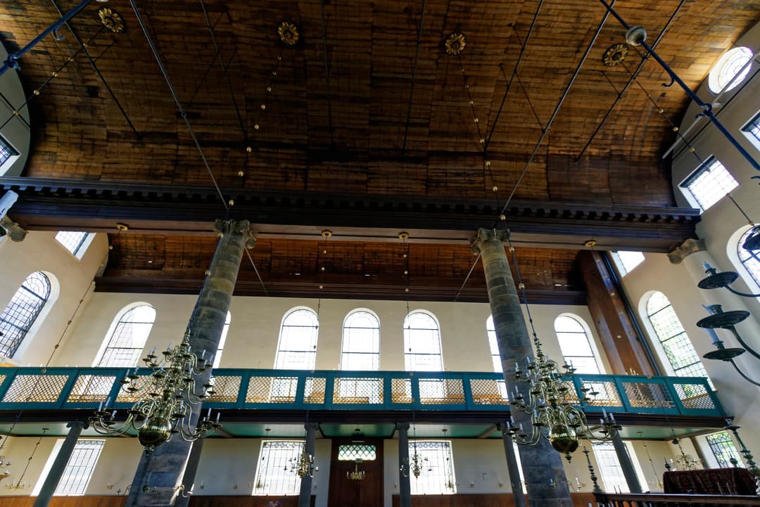 Interior view of the Portuguese Synagogue's wooden ceiling and columns.