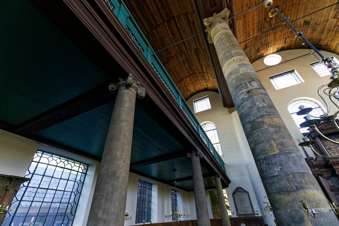 Interior view of the Portuguese Synagogue columns and women's gallery.