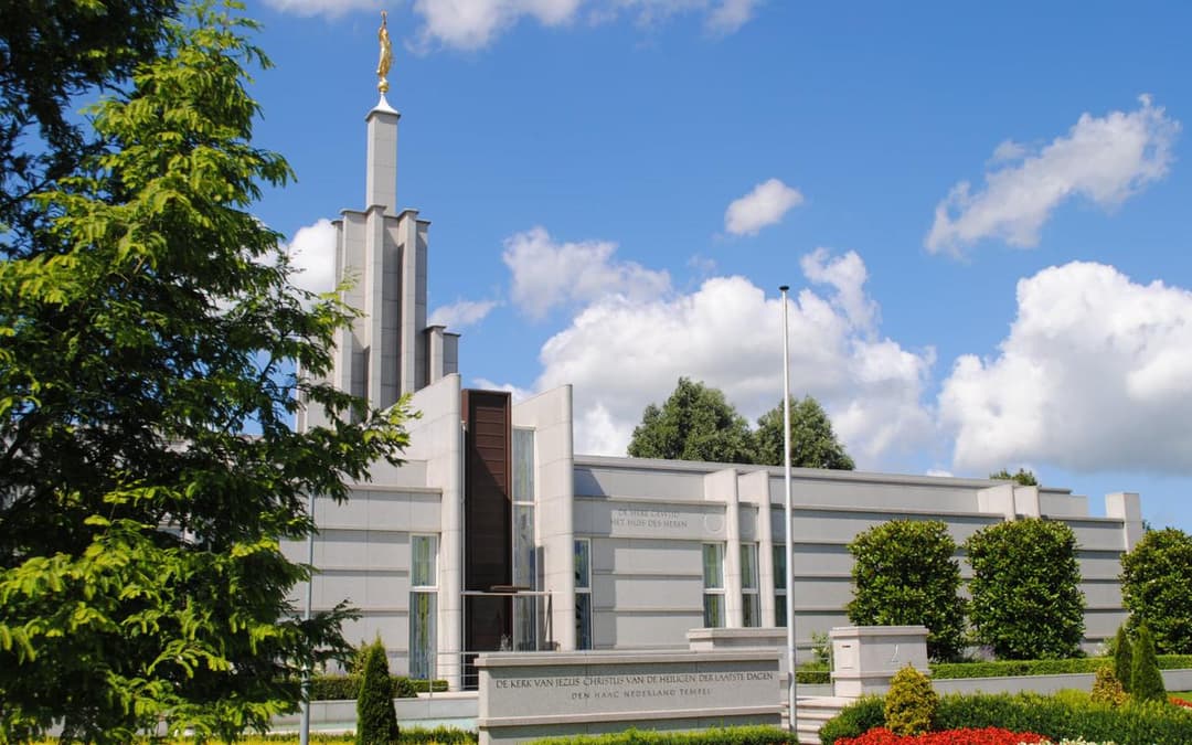 Daytime exterior view of The Hague Netherlands Temple and spire.