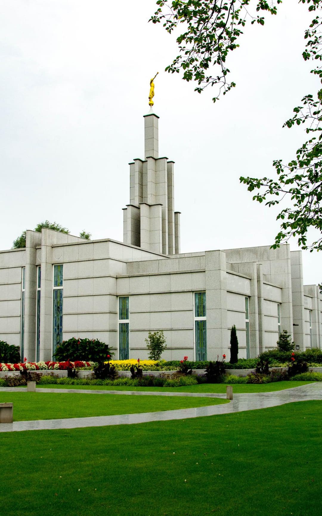 Exterior view of The Hague Netherlands Temple and its manicured grounds.