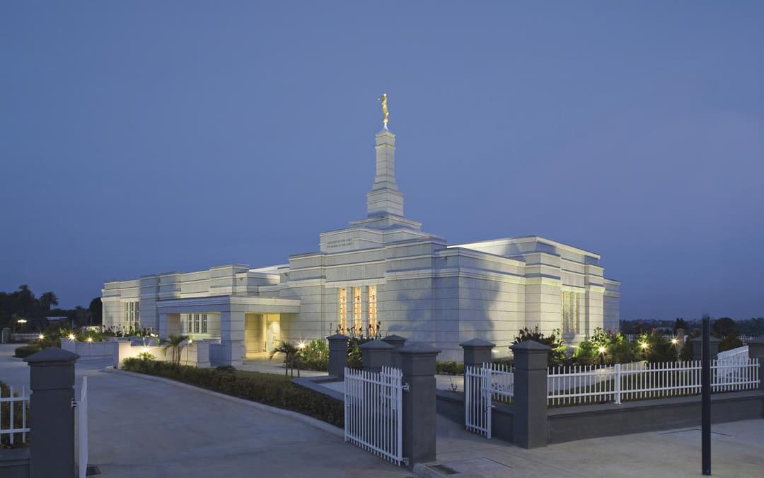The Aba Nigeria Temple surrounded by lush greenery.