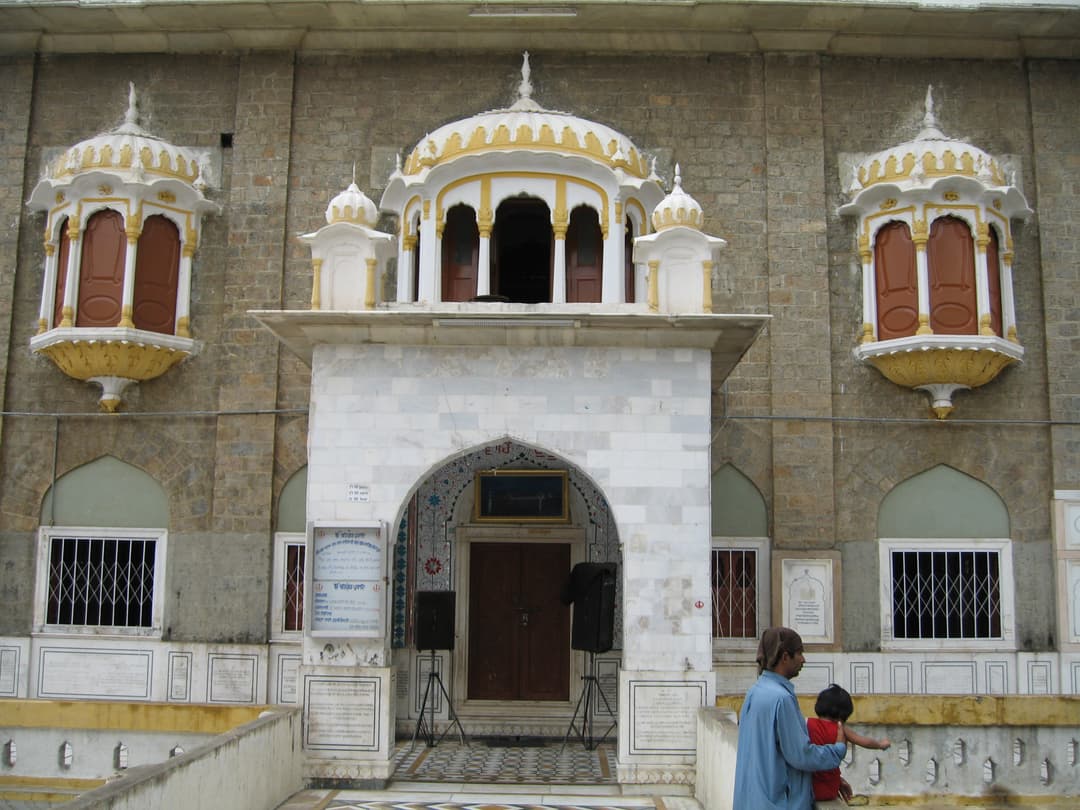 Marble entrance and ornate jharokha windows of Gurdwara Panja Sahib