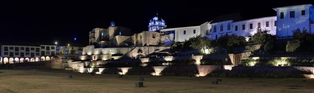 Panoramic night view of illuminated Qorikancha and Santo Domingo Convent