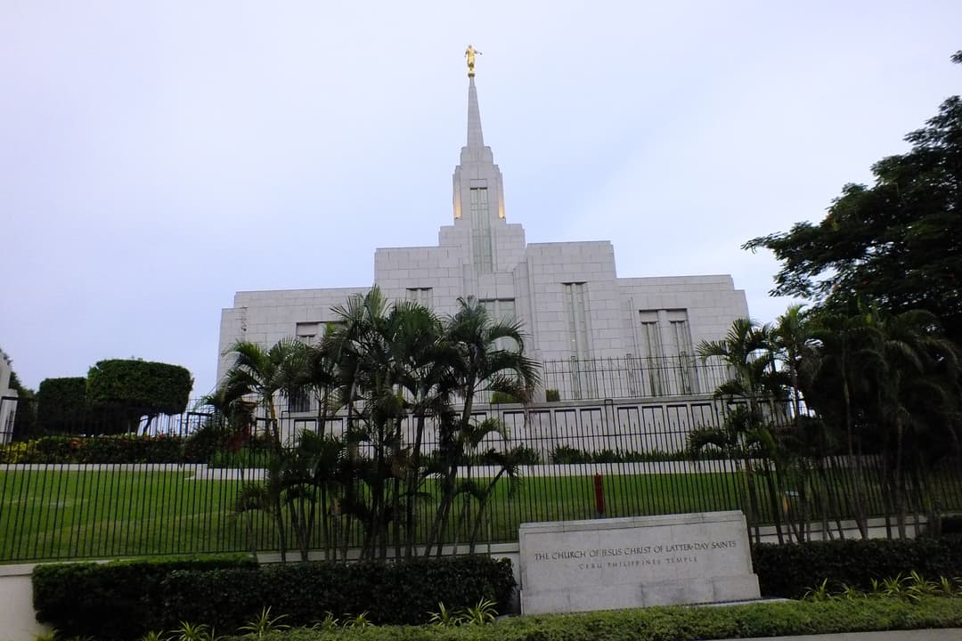 Wide-angle view of the Cebu Philippines Temple and sign at twilight.