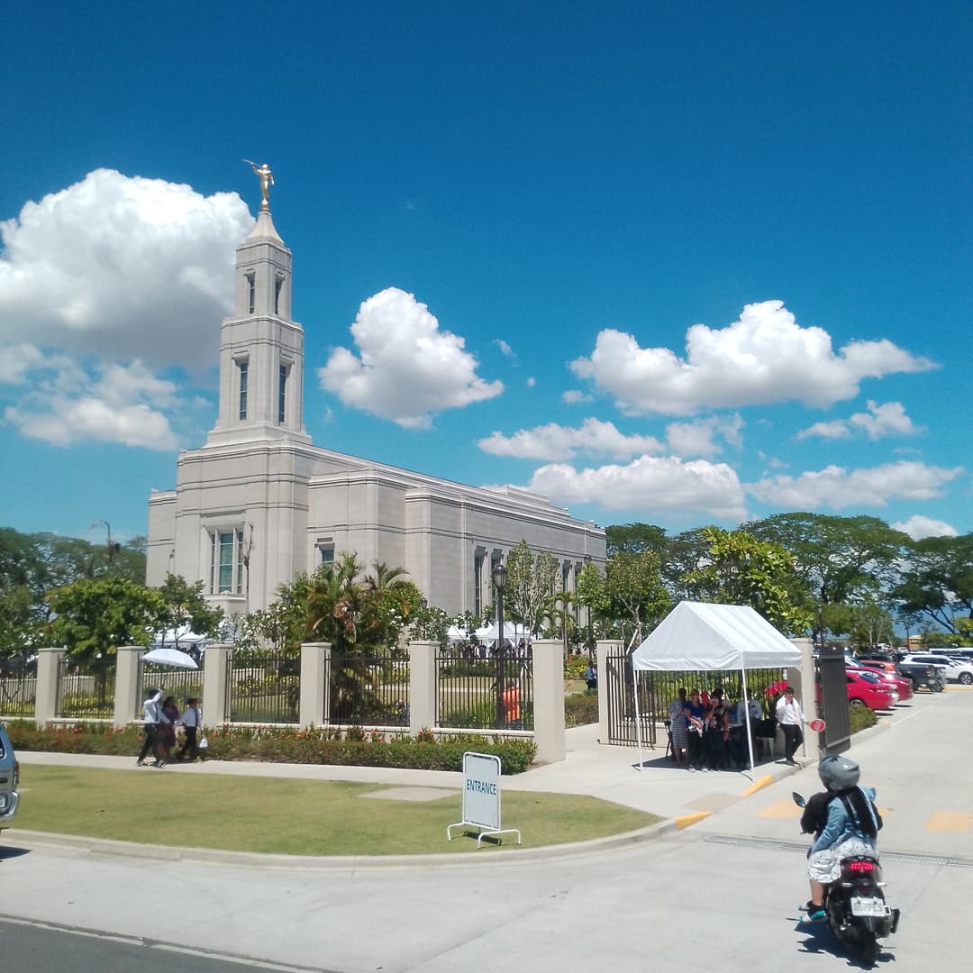 Exterior view of the Urdaneta Philippines Temple and spire on a sunny day.