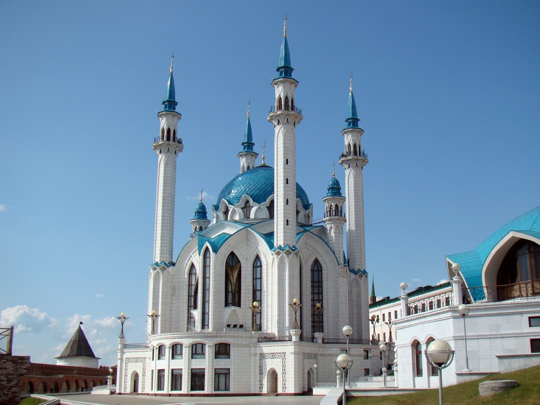 Exterior of Kul Sharif Mosque with blue dome and minarets in daylight.