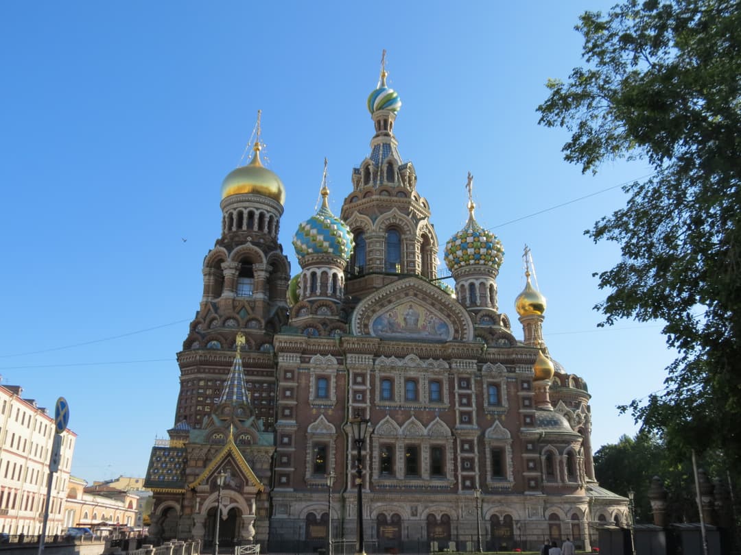 South facade and colorful onion domes under a clear blue sky