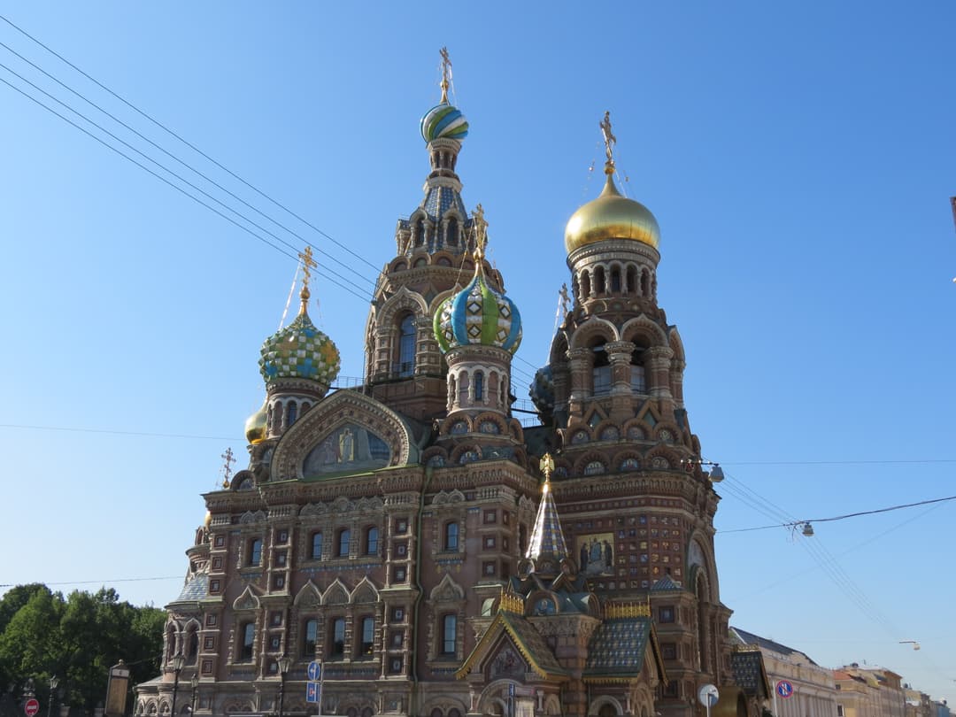 Exterior view of the colorful onion domes and gilded bell tower