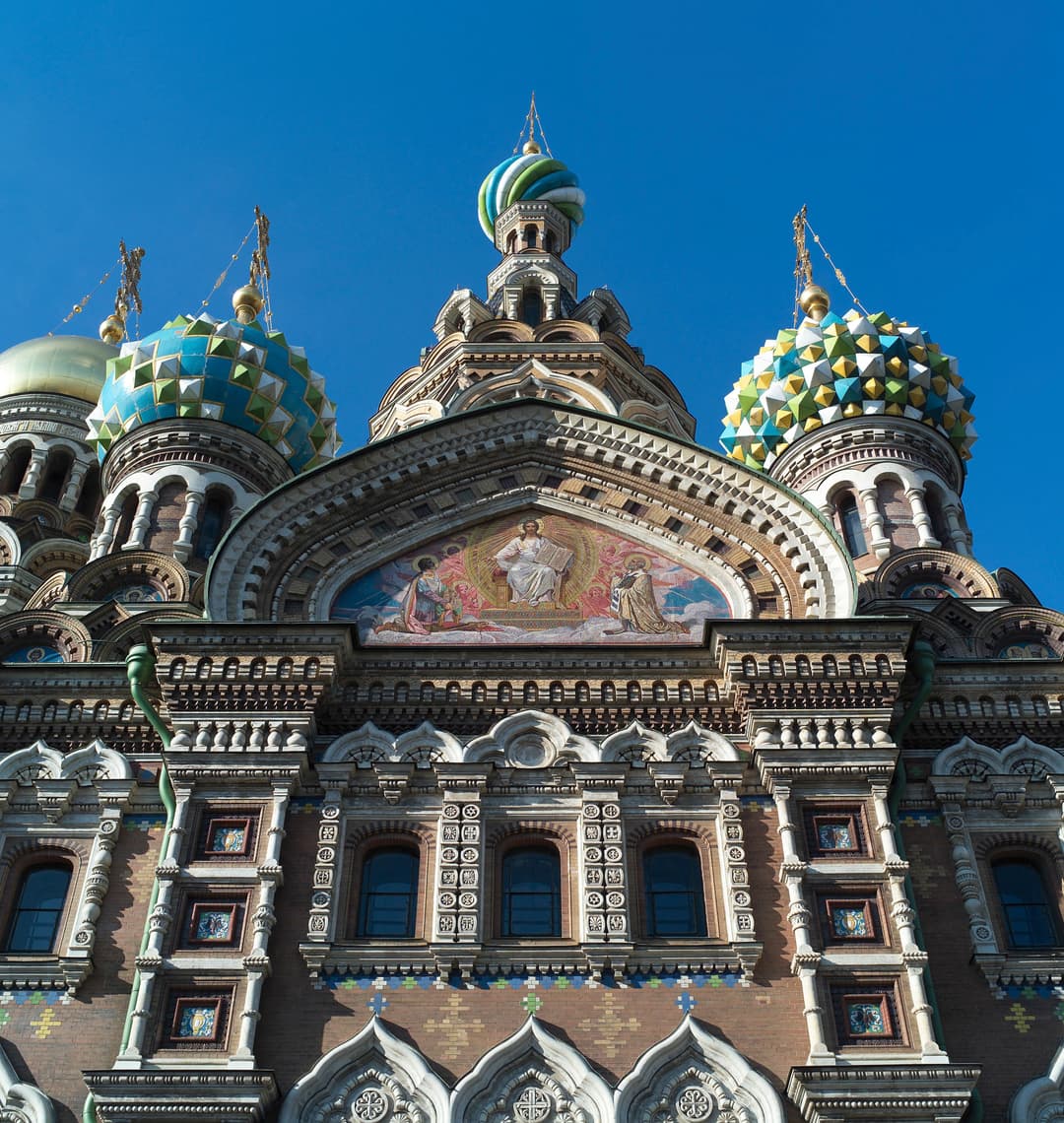 Exterior detail of facade mosaic and colorful onion domes