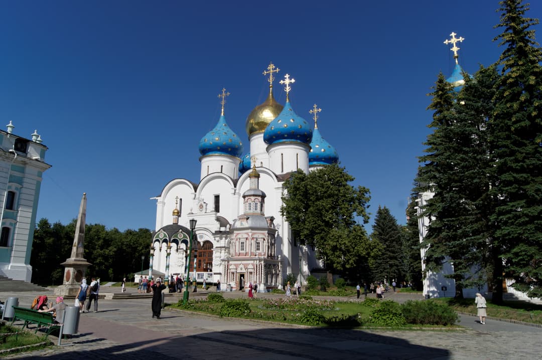 Assumption Cathedral and the Well Chapel on the sunny monastery grounds