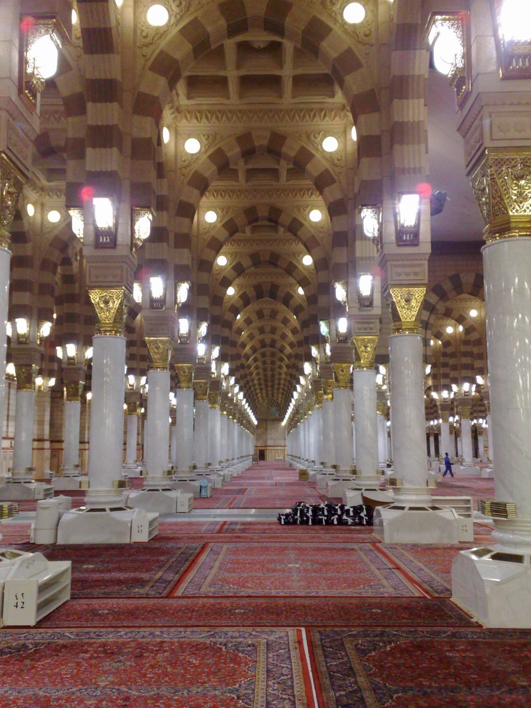 A view of the mosque's courtyard with worshippers during prayer time.