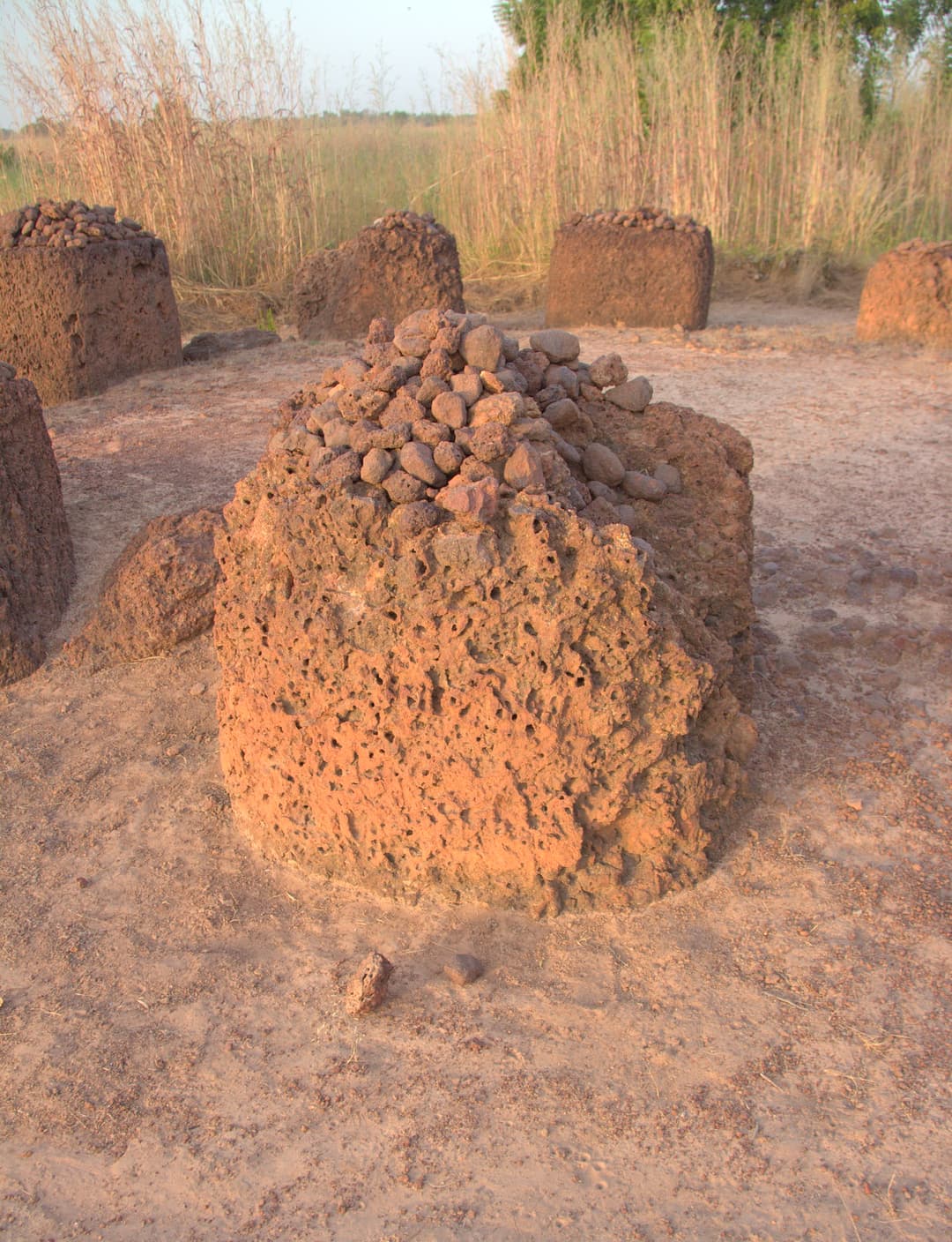 Porous laterite monolith topped with small stones at Sine Ngayène