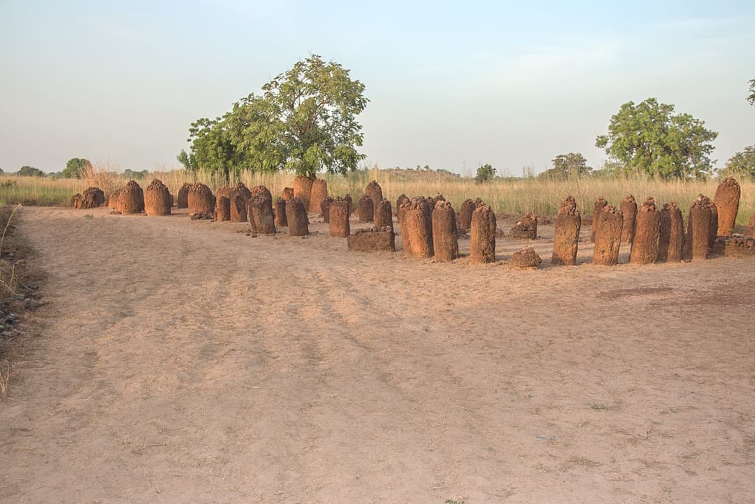 Laterite stone circles at Sine Ngayène under late afternoon light.