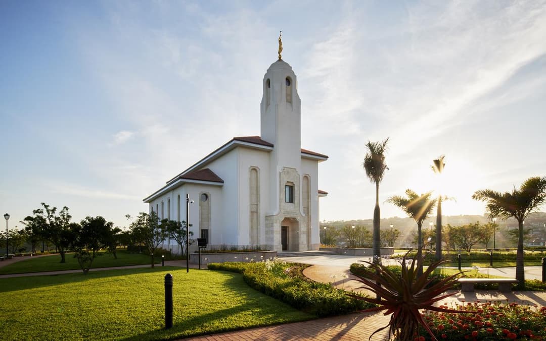 Durban South Africa Temple exterior, Angel Moroni, gardens, and morning sun.