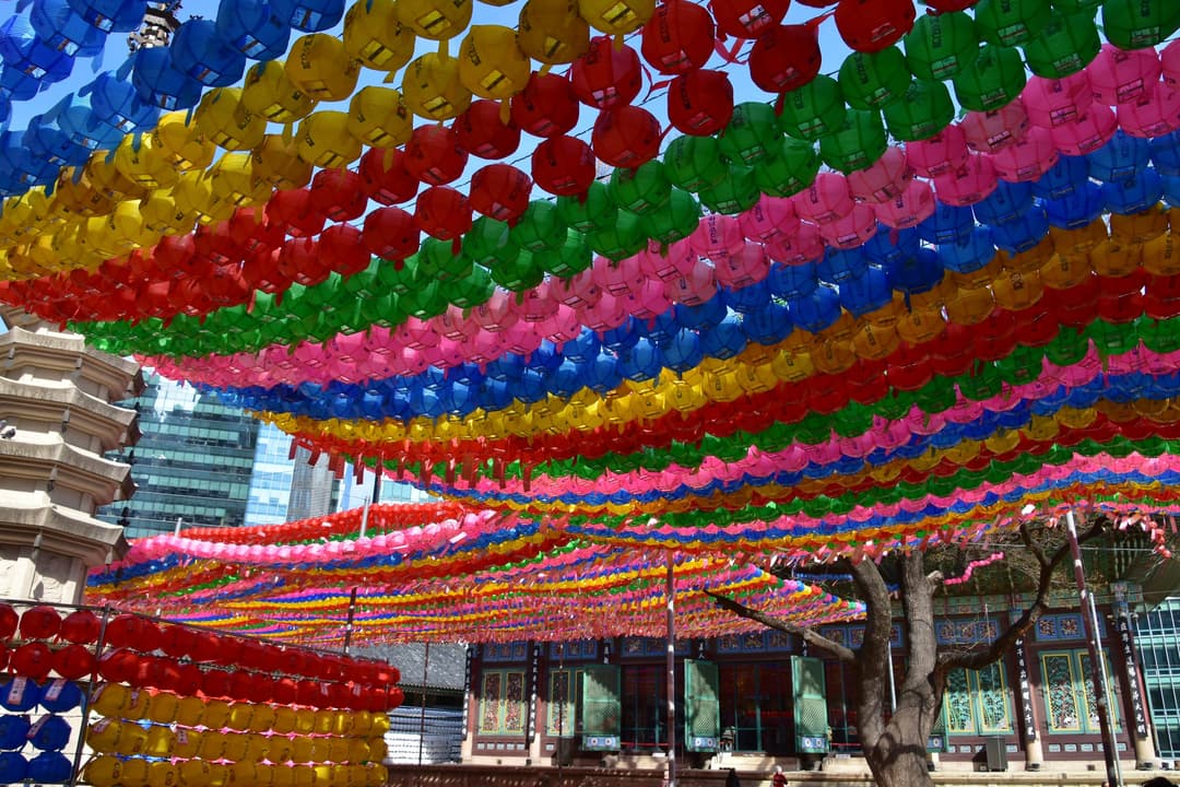 Vibrant canopy of colorful lotus lanterns in the Jogyesa Temple courtyard.
