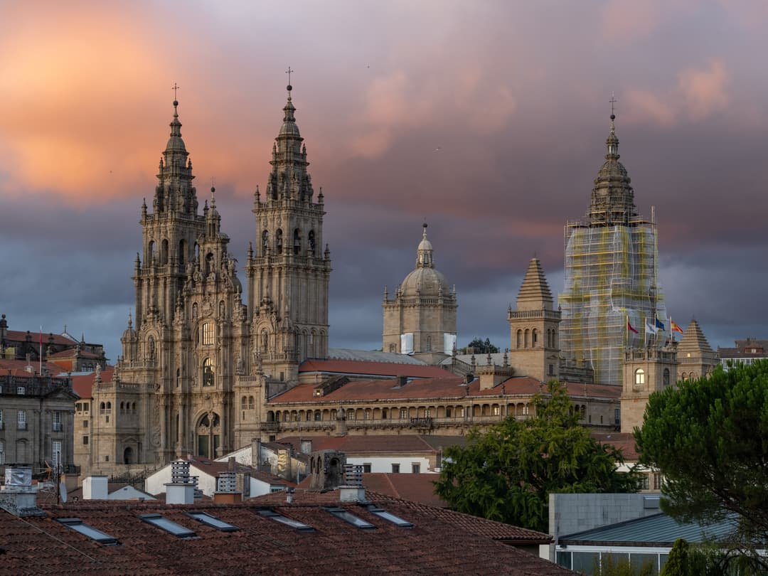 Santiago de Compostela Cathedral spires over rooftops at twilight