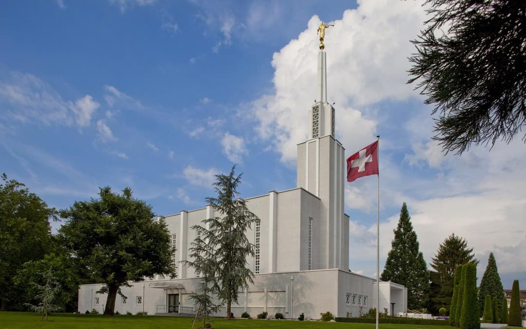 The Bern Switzerland Temple with a blue sky.