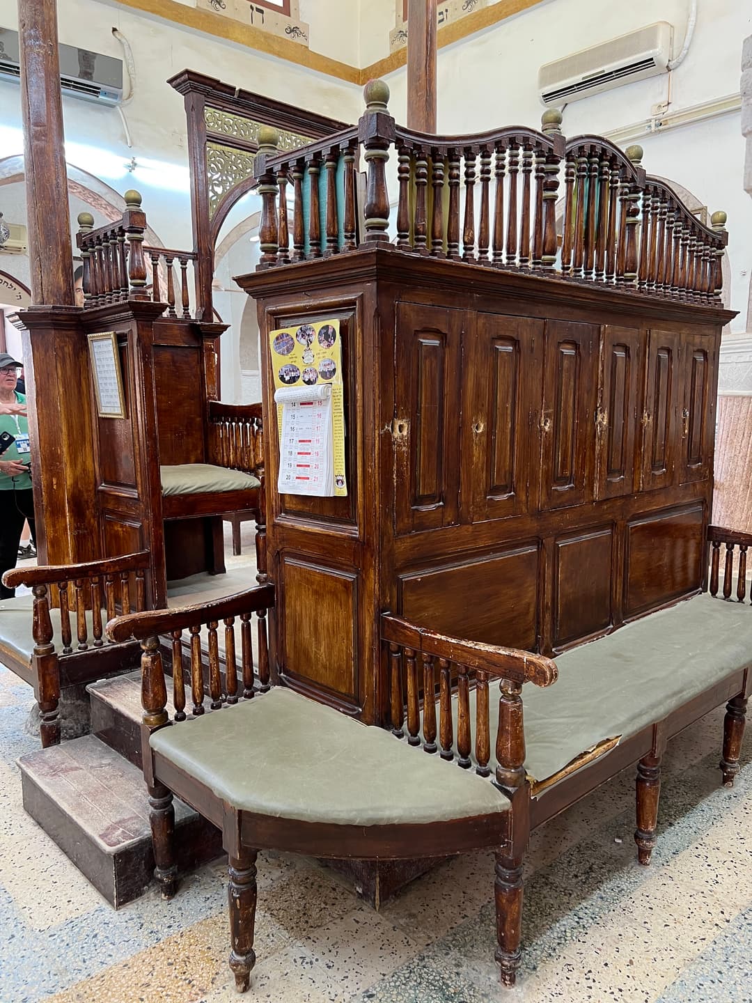 Wooden bimah and seating inside the El Ghriba Synagogue