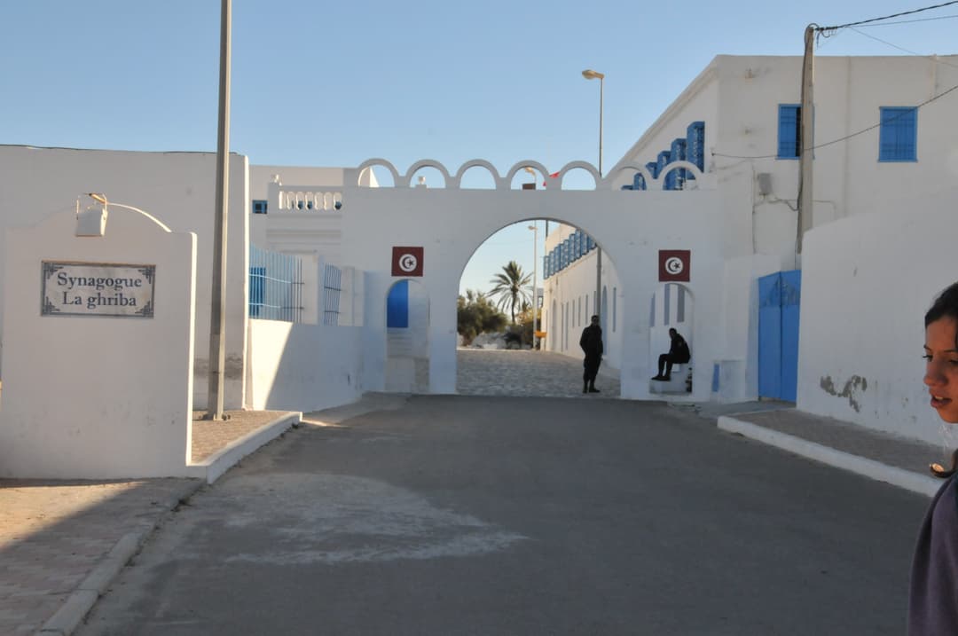 Whitewashed entrance gate to the El Ghriba Synagogue compound.