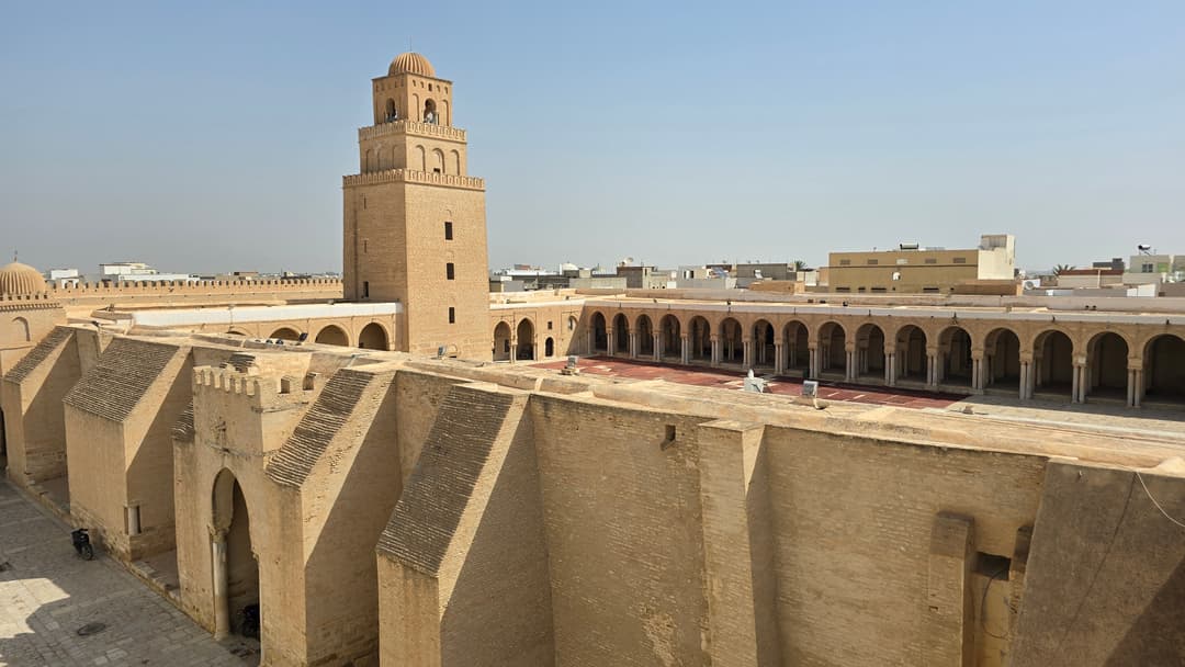Elevated view of the massive ramparts, minaret, and arcaded courtyard