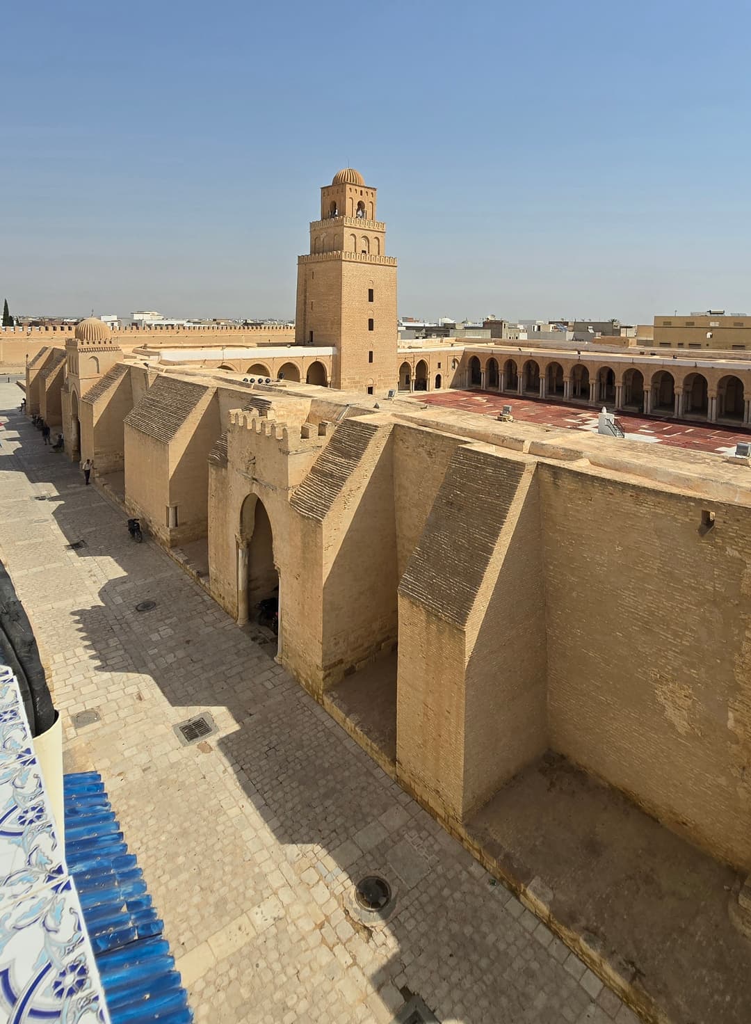 Elevated view of the fortified outer walls, courtyard, and minaret