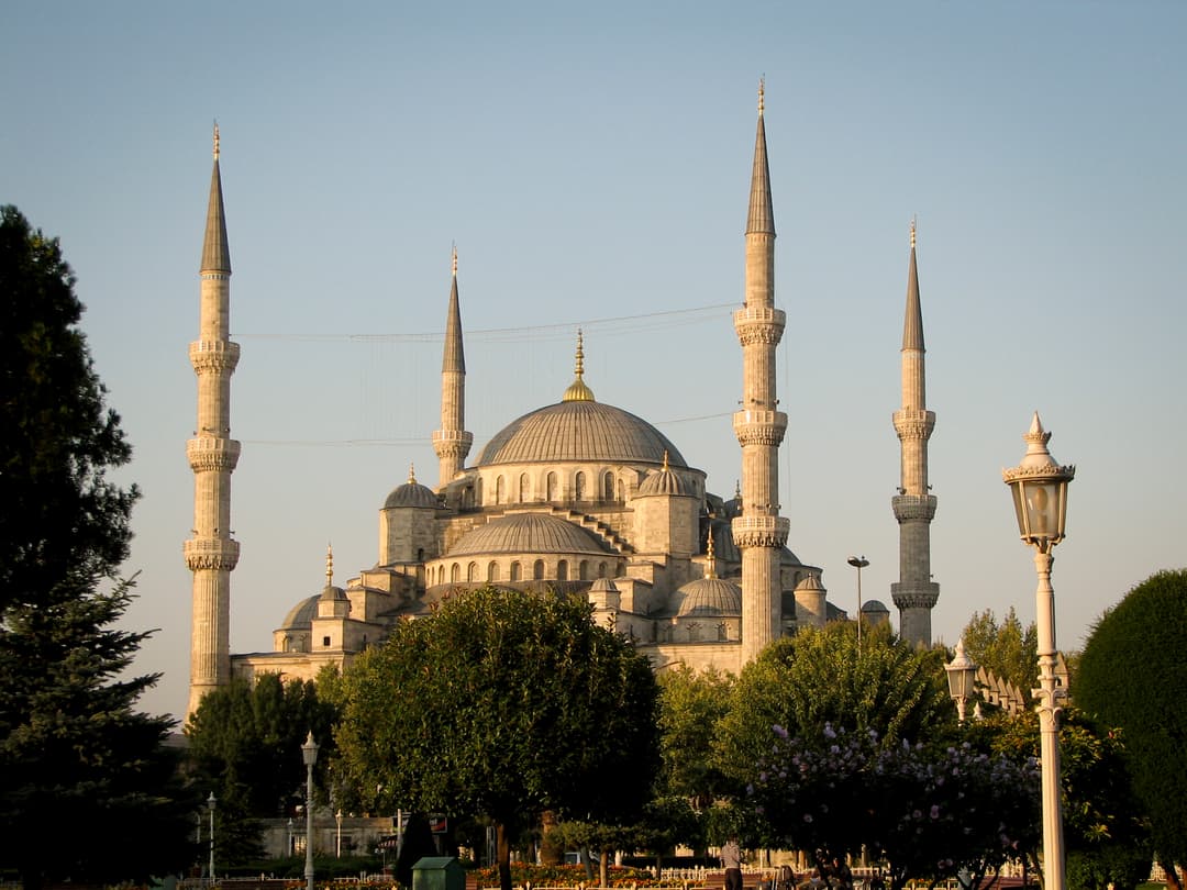 Worshippers inside the Blue Mosque, experiencing its spiritual ambiance.