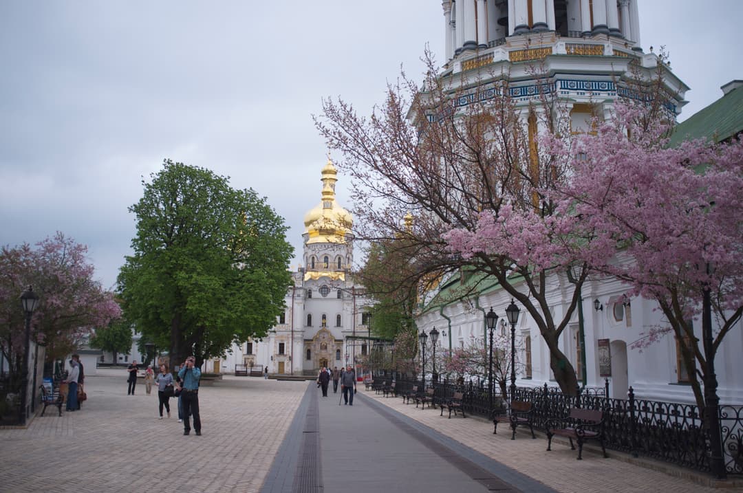 Walkway to the Gate Church of the Trinity framed by spring blossoms
