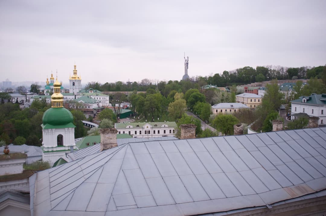 Elevated view over Pechersk Lavra rooftops with the Motherland Monument