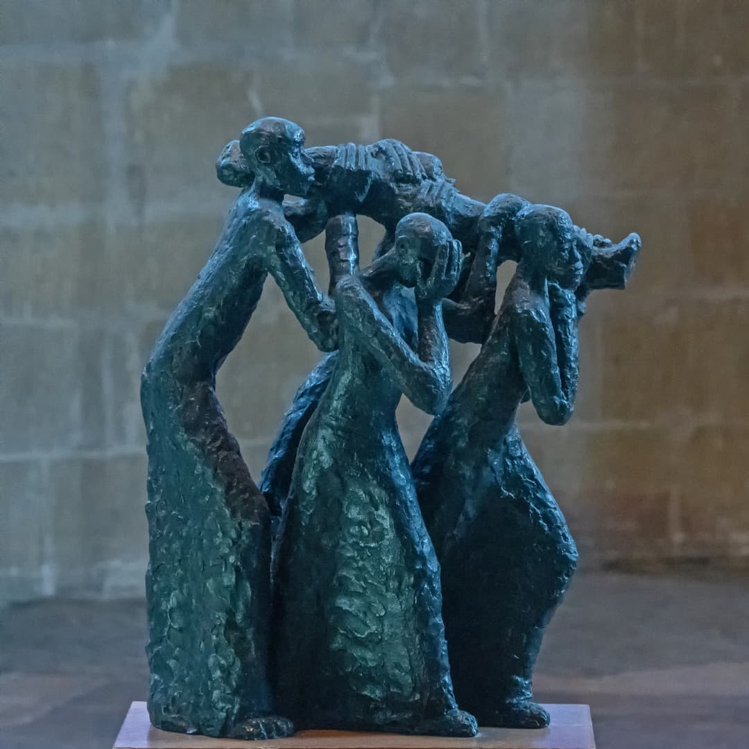 Bronze sculpture of figures carrying a body, Canterbury Cathedral