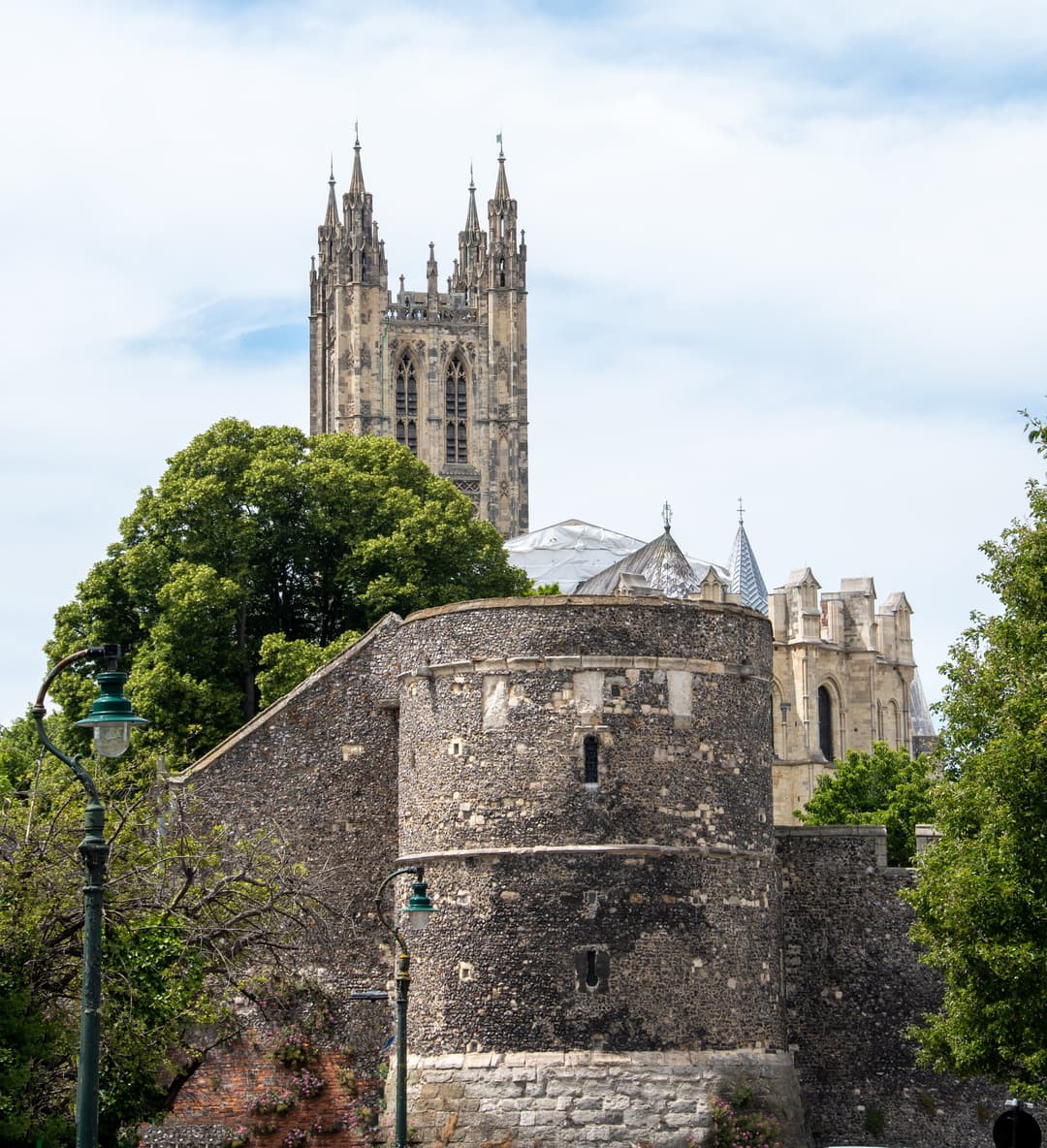 Bell Harry Tower rising beyond Canterbury's medieval city wall