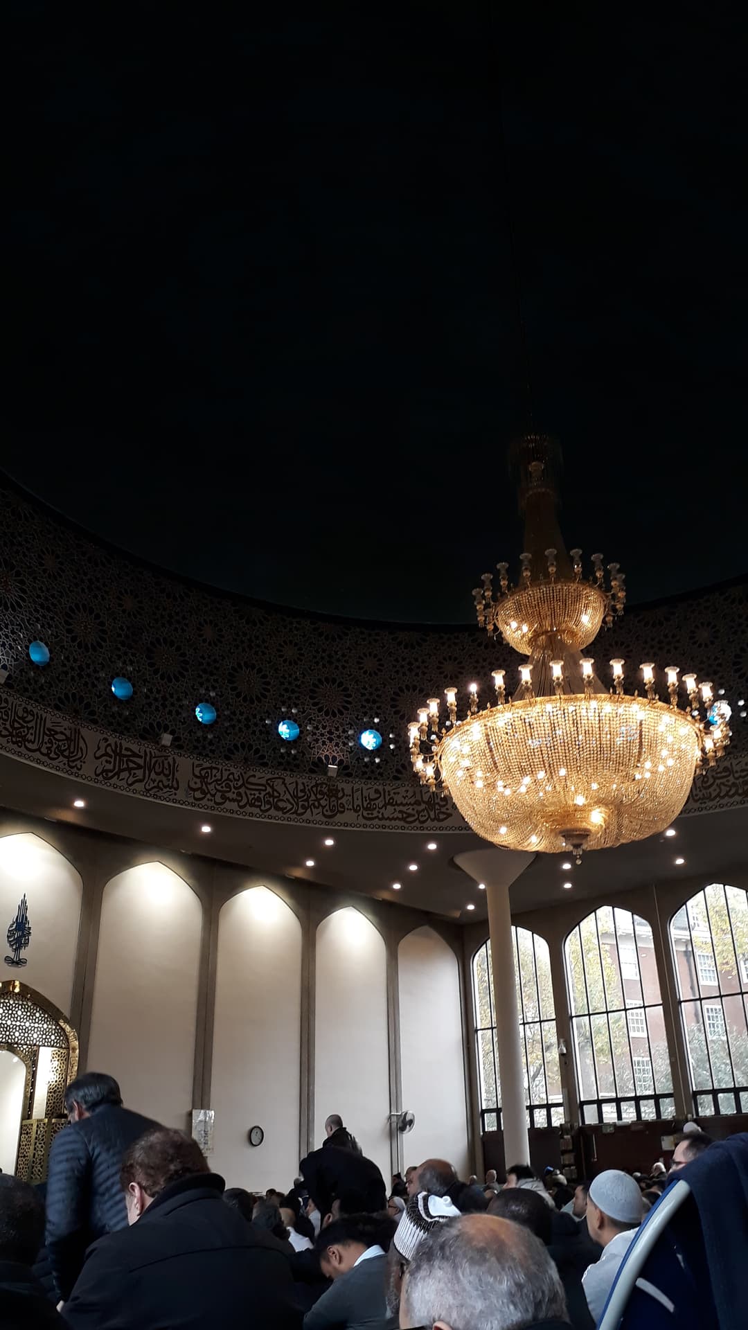 Interior view of the main prayer hall featuring the central chandelier.