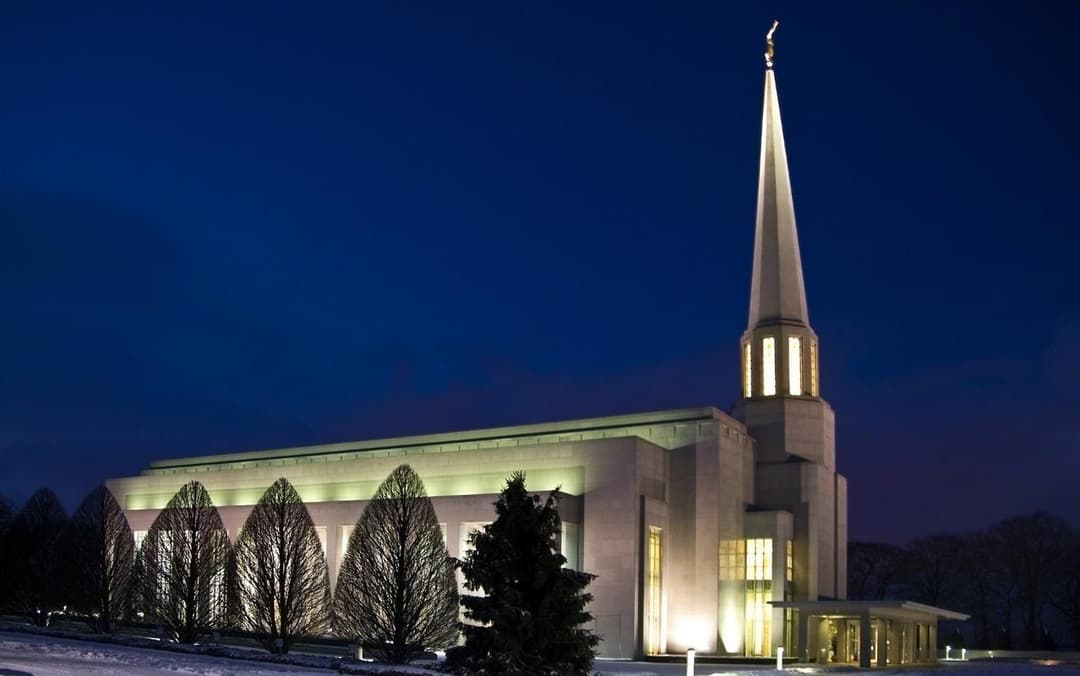 The temple illuminated at night.