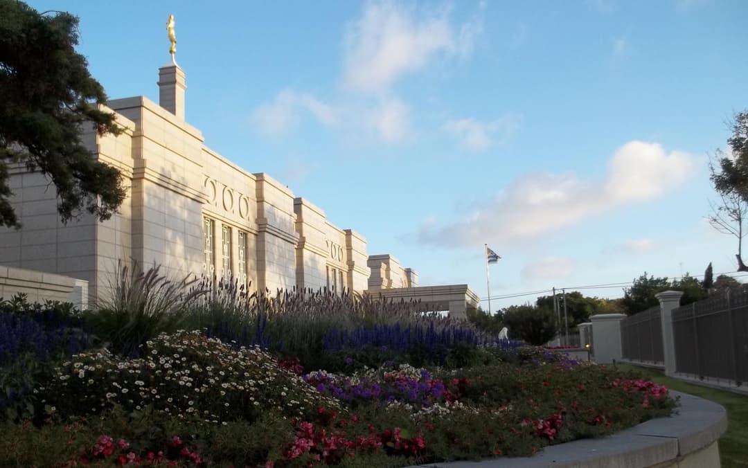 Montevideo Uruguay Temple exterior, Angel Moroni, and gardens at late afternoon.