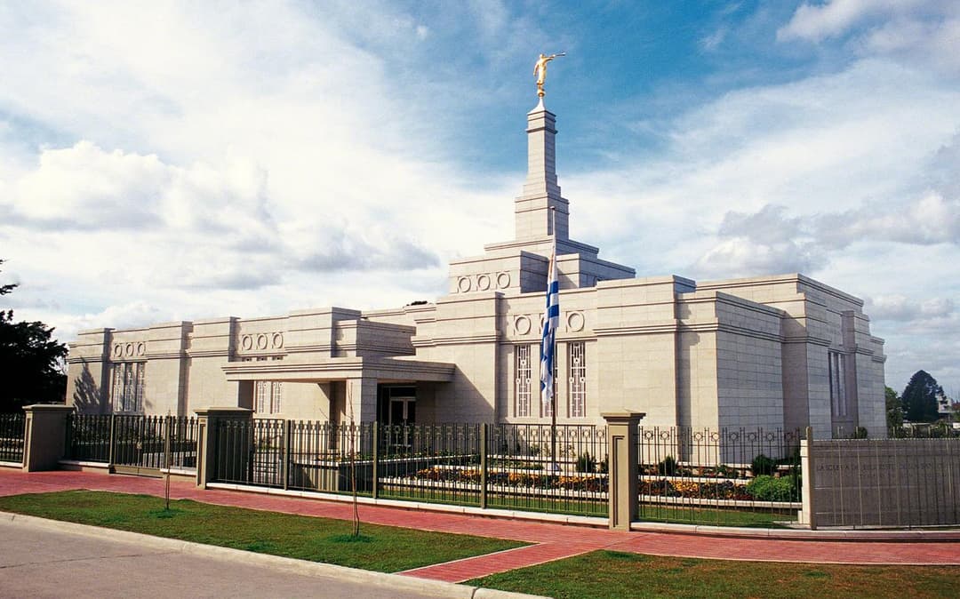 Montevideo Uruguay Temple exterior with Angel Moroni, Uruguayan flag.