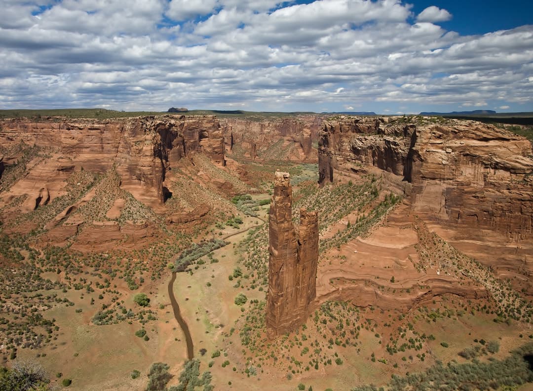 High-angle wide view of Spider Rock rising from the Canyon de Chelly floor.