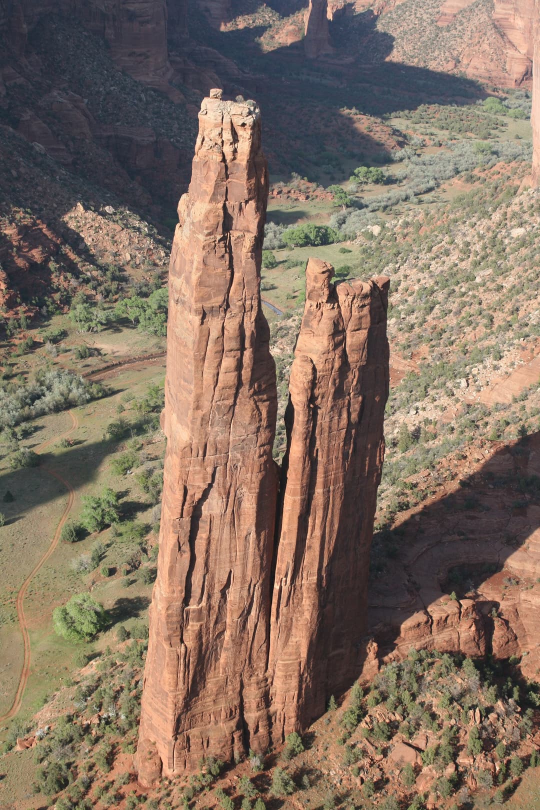 High-angle view of the twin sandstone spires of Spider Rock.