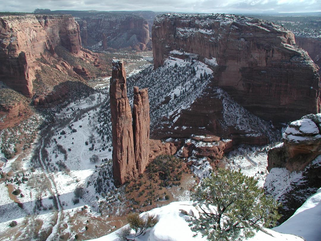 High-angle view of Spider Rock spire in snow-covered Canyon de Chelly.