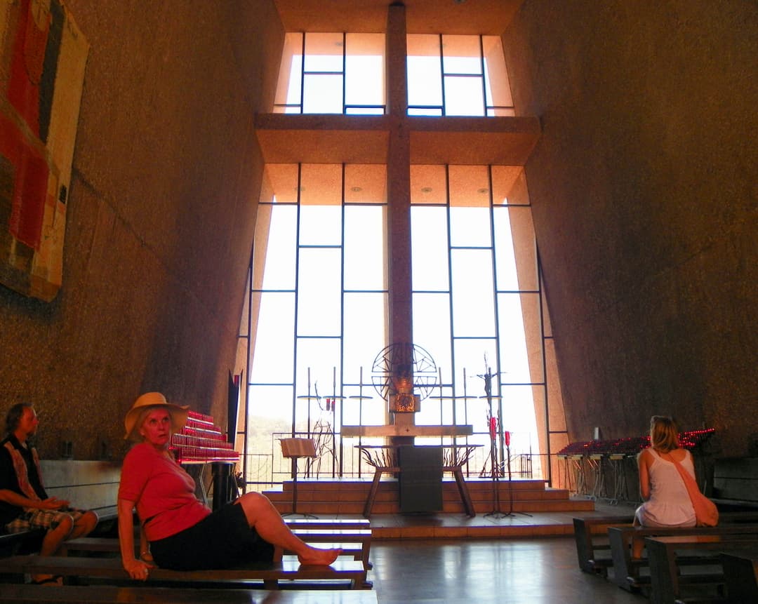 Interior view facing the altar and cross window, Chapel of the Holy Cross.