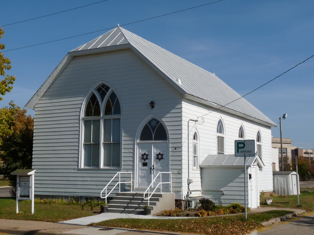 Angled exterior view of the front entrance and side facade