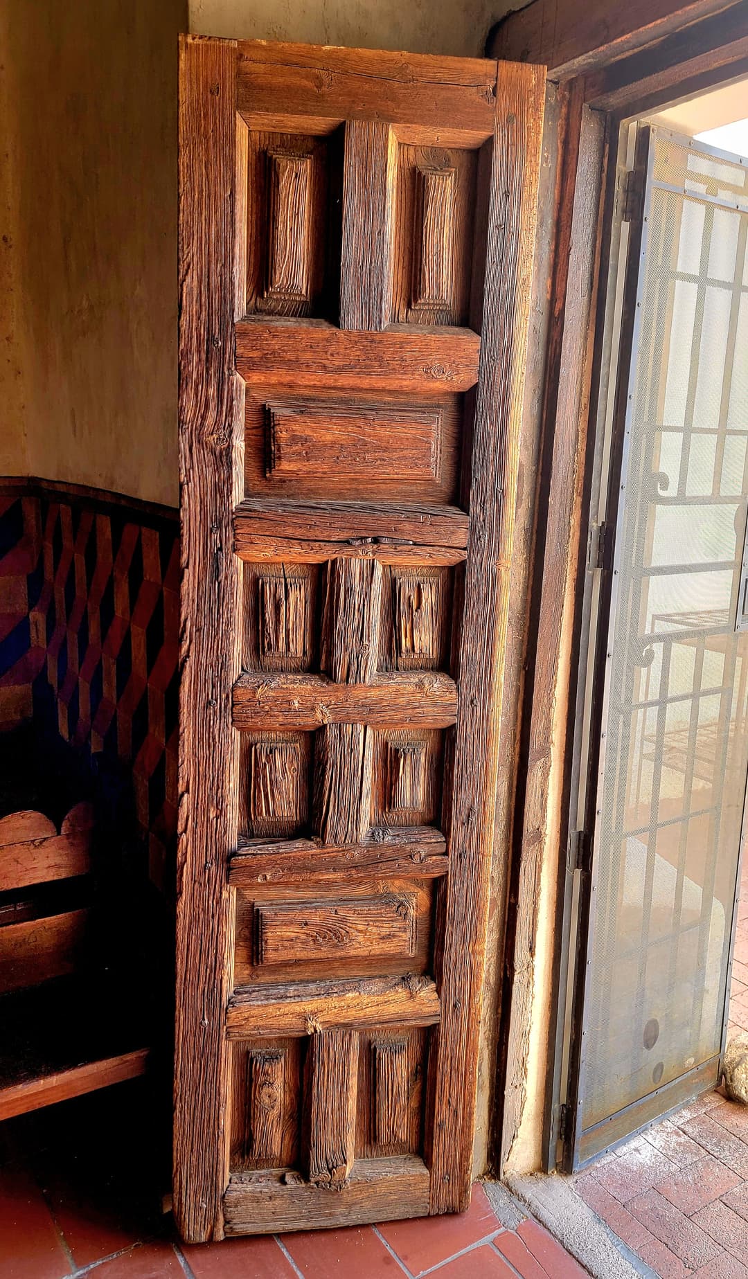 Carved Spanish Colonial wooden door inside Mission San Xavier del Bac.