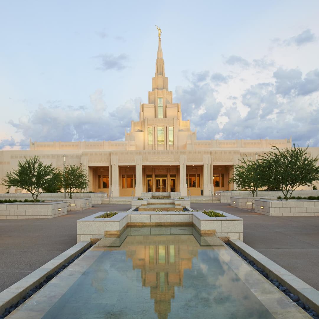 Front view of the Phoenix Arizona Temple and reflecting pool at dusk.