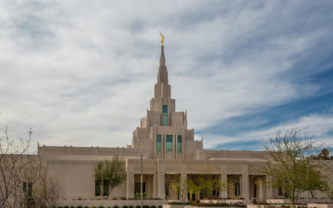 Daytime front view of the Phoenix Arizona Temple and its central spire.
