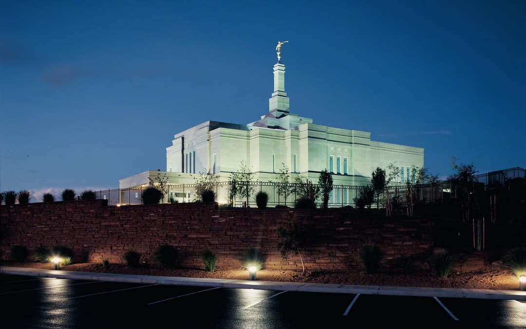 Illuminated exterior view of the Snowflake Arizona Temple at twilight.