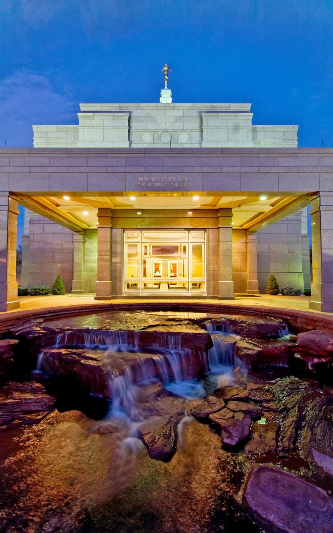 Snowflake Arizona Temple entrance and rock fountain feature at twilight.