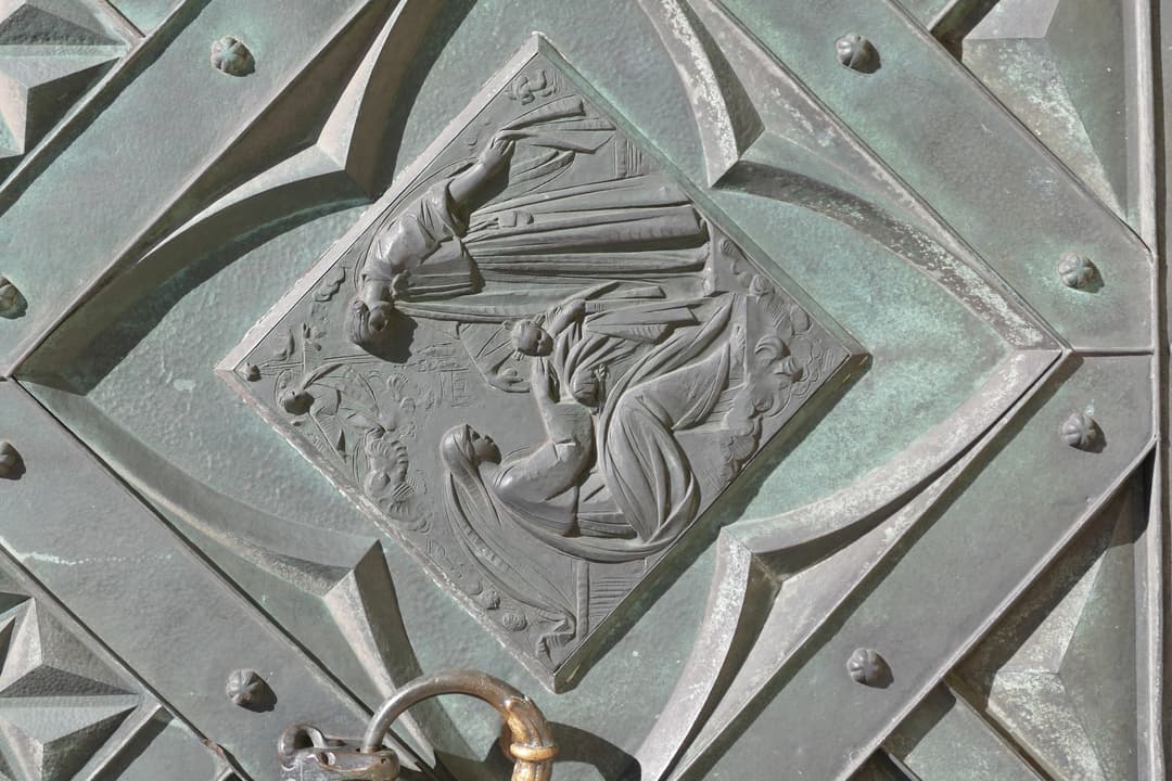 Relief detail on the bronze entrance door of St. Mary's Basilica.