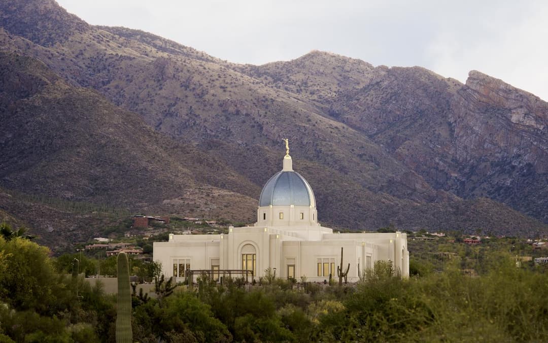 Wide view of the Tucson Arizona Temple against the Santa Catalina Mountains.