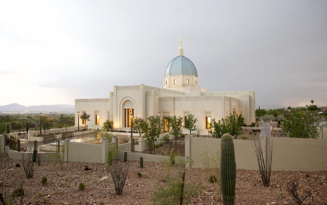 Exterior view of the Tucson Arizona Temple and desert grounds at dusk.