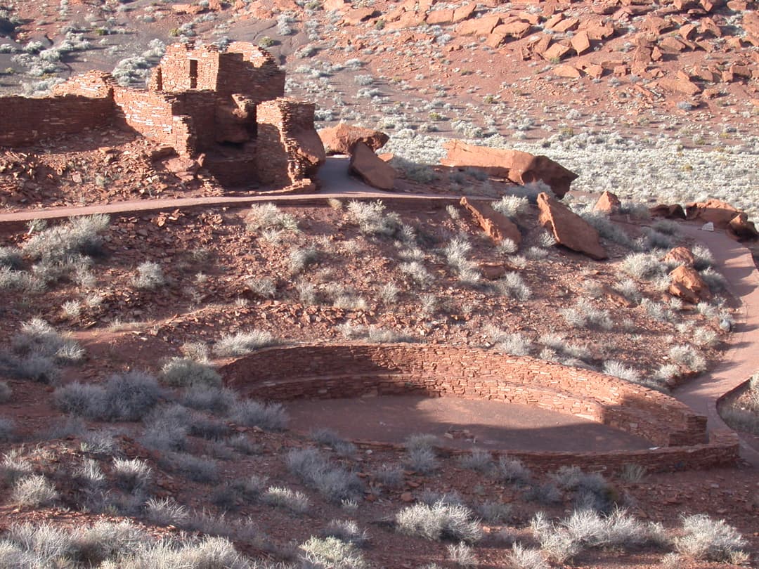 Elevated view of the circular kiva and multi-story Wupatki Pueblo ruins.